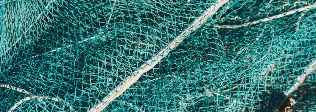 BANNER abstract close-up macro real photo beautiful wallpaper. Fisherman rope net texture fiber surface pattern. Sea blue green light colour. Futuristic subtle waving lines art modern. Dark background