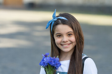 glad girl with spring flowers on mothers day