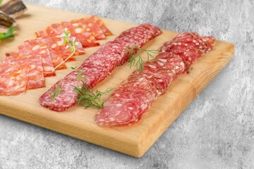 Traditional ham spiral sliced on desk with oranges and rosemary