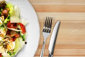 Fresh spring vegetable salad with tomatoes and peppers in the bowl.