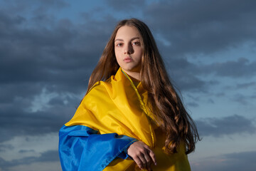 patriotic teen ukrainian girl with blue yellow flag of ukraine