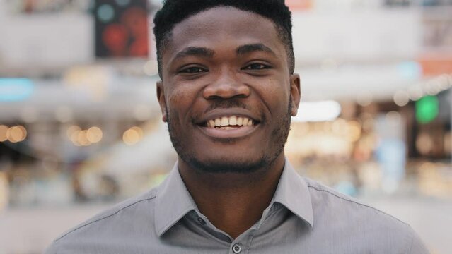 Portrait happy african american man talking on video link looking at camera chatting speaking laughing enjoy online conference conversation smiling guy blogger recording vlog interview webcam view