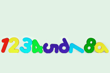 colorful wooden eco numbers isolated on light background. back to school concept.learning and...