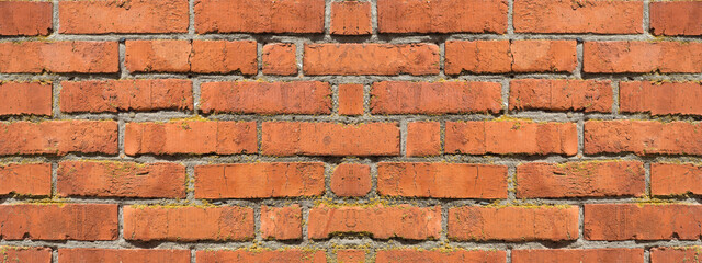 The textured surface of an old red-brown brick wall. Banner. Vintage Textured Background. Space for text