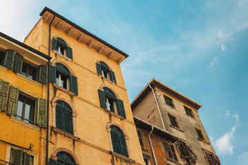 Fototapeta premium Beautiful old buildings on Verona street, Italy. Amazing blue sky.
