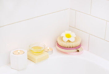 White Background Bath Candle Plumeria Flower Bamboo Face Brush SPA at Home Concept Horizontal