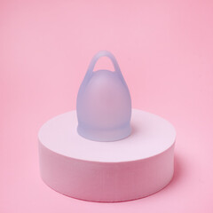 Women Health Concept Zero Waste Blue Menstrual Cup on Podium Alternative Reusable Product for Female Hygiene during Periods Minimalis
