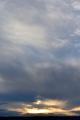 Sunset horizon in the evening bright yellow red clouds