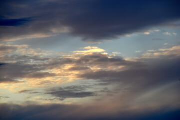 Sunset horizon in the evening bright yellow red clouds