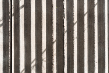 Asbestos cement sheets with shadows. Texture of old laid roofing sheets background for design