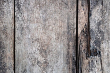 Wooden natural background, old paint on wooden fence surface. Vintage retro cracked wooden planks