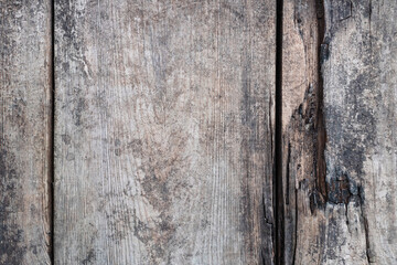 Wooden natural background, old paint on wooden fence surface. Vintage retro cracked wooden planks