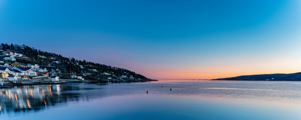 Sunset over the Oslofjord in the small town of Hvitsten, between Drobak and Son - obrazy, fototapety, plakaty