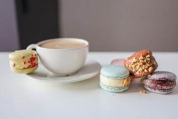 Morning coffee with macaroons in a cafe, good morning