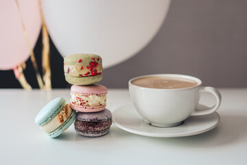 Morning coffee with macaroons in a cafe, good morning birthday