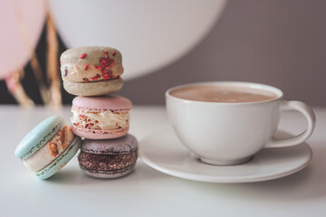 Morning coffee with macaroons in a cafe, good morning birthday