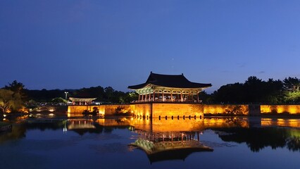 Naklejka premium building, korean, traditional, calm, garden, architecture, old, national, duck pond, asian, culture, famous, water, park, dark, landmark, night, colourful, travel, nature, palace, evening, korea, 안압지