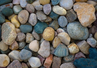Fototapeta na wymiar Rocks on the beach, rock background, pebbles, colorful wallpaper.