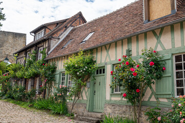 One of most beautiful french villages, Gerberoy - small historical village with half-timbered houses and colorful roses flowers, France