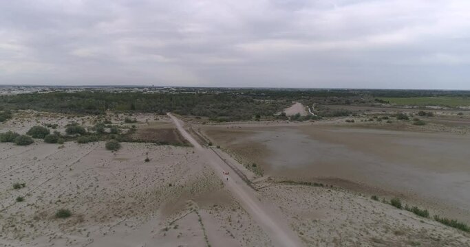 Drone flying over field on the sea sand in South of France world famous beach 