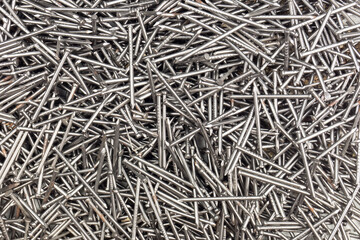 loose group of small nails background closeup