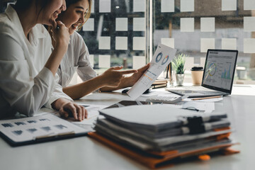Asian business adviser meeting to analyze and discuss the situation on the financial report in the meeting room.Investment Consultant, Financial advisor and accounting concept