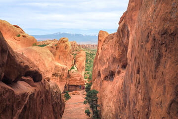 Fototapeta premium View of Fin Canyon on the Devil's Garden trail in the Arches National Park, Utah, USA. Sandstone rock geological formations in Utah desert. Hiking in the American southwest on a nice day of spring.