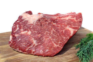 Fresh raw meat lies on a cutting board.