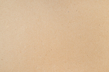 Smooth clean blank sheet of light brown cardboard as texture or background