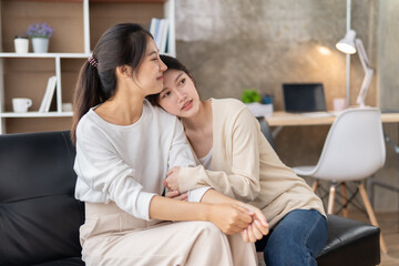 Fototapeta premium LGBT Lesbian couple love moments happiness , lovely lesbian couple spending time together and having fun at living room, LGBT concept.