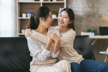 LGBT Lesbian couple love moments happiness , lovely lesbian couple spending time together and having fun at living room, LGBT concept.