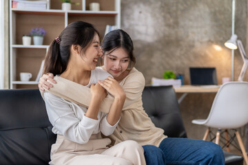 LGBT Lesbian couple love moments happiness , lovely lesbian couple spending time together and having fun at living room, LGBT concept.