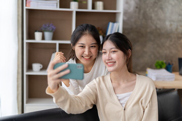 LGBT Lesbian couple love moments happiness , lovely lesbian couple spending time together and having fun at living room, LGBT concept.