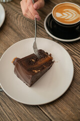 dessert lies on a table in a cafe and is eaten with a fork