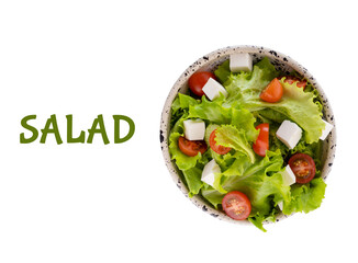 Salad with green lettuce, cherry tomatoes and curd cheese cubes in a round plate isolated on white...