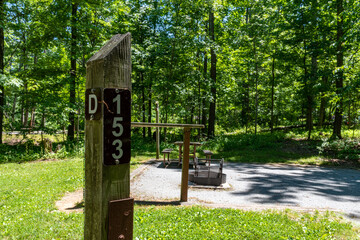 A sign marks a campsite at a campground.
