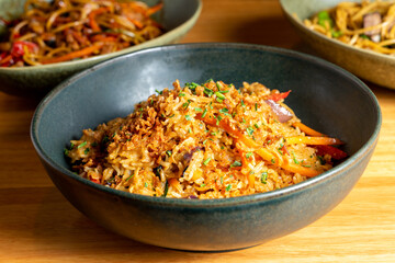 Thai dish of rice, chicken, tomato, soy sauce, chili paste, cilantro, lime, chili pepper green onion spices. High quality photo