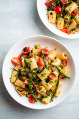 Pasta salad with grilled vegetables, zucchini, eggplant, asparagus and tomatoes.