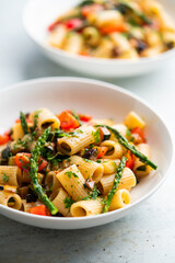Pasta salad with grilled vegetables, zucchini, eggplant, asparagus and tomatoes.