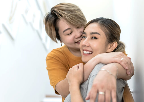 portrait of happy young Asian LGBTQ lesbian couples hugging and feeling love with each other