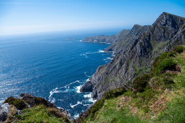 Stunning nature scene of Achill island, county Mayo, Ireland. Green hills and blue sky and ocean...