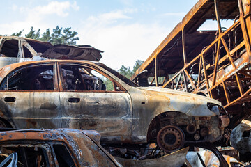 The car burned down completely, even the tires burned out. Burnt out car crash after fire. The bomb...