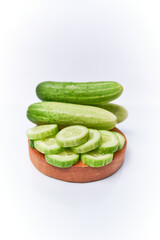 Close-up of fresh young cucumber isolated on a white background