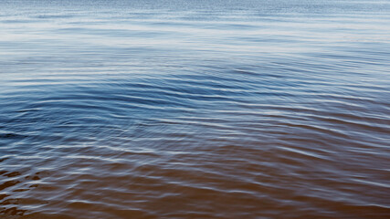 Naklejka premium Lightly wavy texture of the water surface of the lagoon.