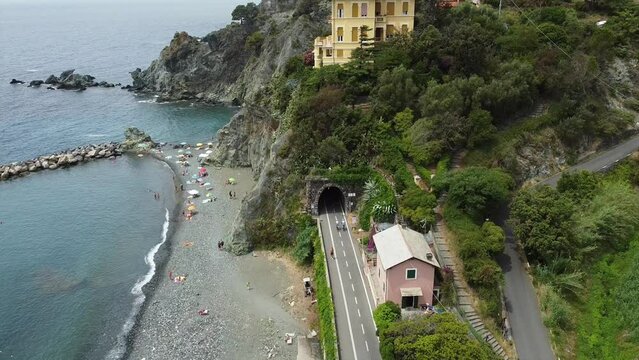 Europe, Italy , Liguria , Drone aerial view of Levanto Bonassola Framura cycle  pedestrian path - old galleries tunnels  in the rock by the sea - tourist attraction in the Cinque Terre