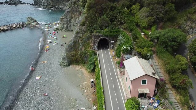 Europe, Italy , Liguria , Drone aerial view of Levanto Bonassola Framura cycle  pedestrian path - old galleries tunnels  in the rock by the sea - tourist attraction in the Cinque Terre