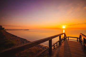 Amazing sunrise in small village Mechelinki. Baltic sea bay.