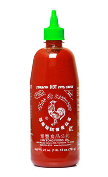 Bottle of Sriracha hot chili sauce isolated on white background