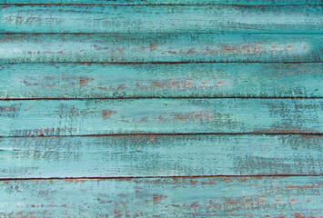 Alter türkisfarbener Holz Hintergrund mit verwitterten Brettern.