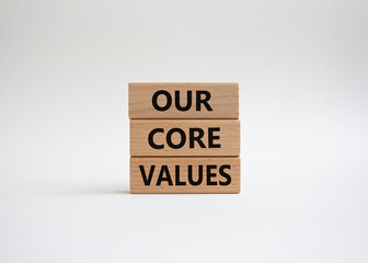 Our core values symbol. Concept words 'Our core values' on wooden blocks. Beautiful white...